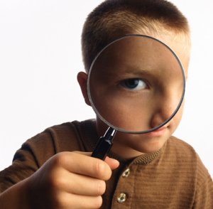 Boy with Magnifying Glass
